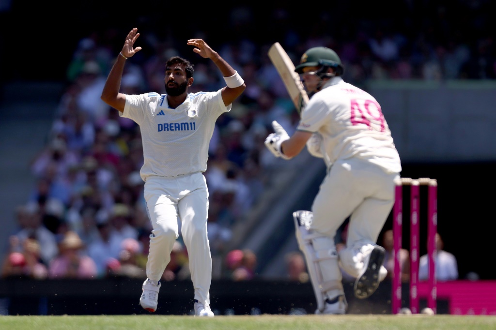 Jasprit Bumrah (L) reacts after Steve Smith hit a shot, AFP