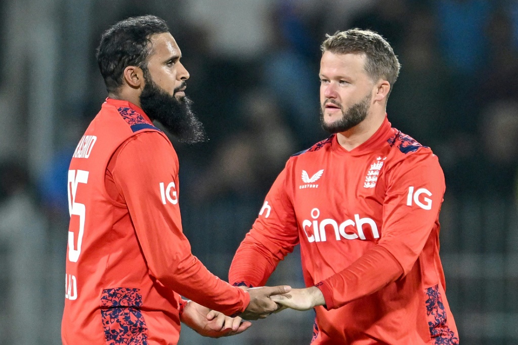 Adil Rashid (L) and Ben Duckett (R) starred as England kept their T20 series against India alive, AFP