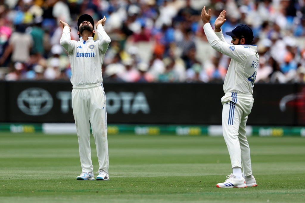 India's Virat Kohli (L) and Rohit Sharma during the fourth Test in Melbourne, AFP