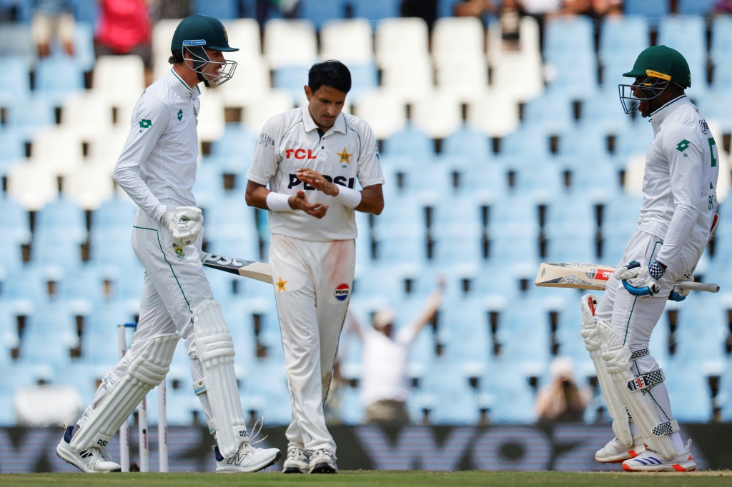 Marco Jansen (L) and Kagiso Rabada (R) celebrate after guiding South Africa to victory in the first Test against Pakistan, AFP