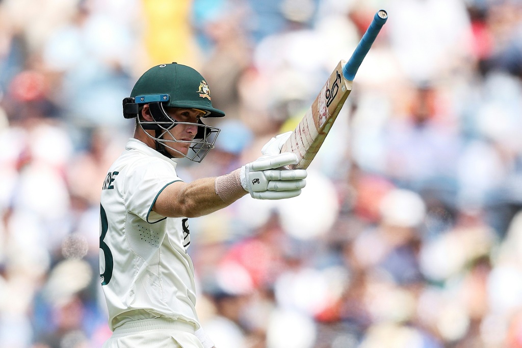 Marnus Labuschagne raises his bat after passing 50, AFP