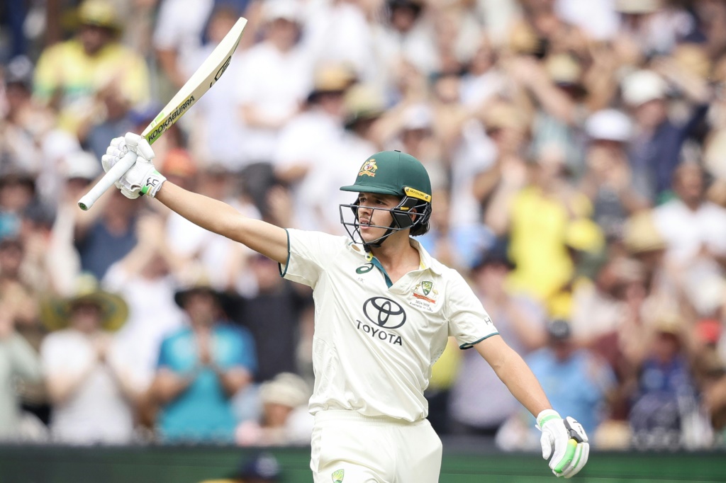 Australia's Sam Konstas raises his bat after passing 50 on day one of the fourth Test against India, AFP