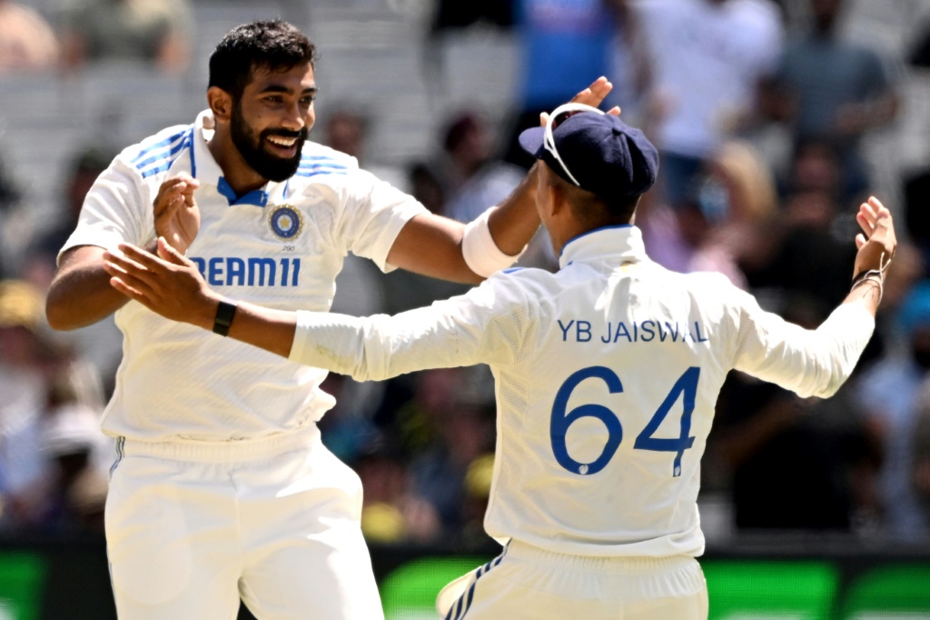 Bumrah (lfet) celebrates with teammate Yashasvi Jaiswal after dismissing Sam Konstas, AFP