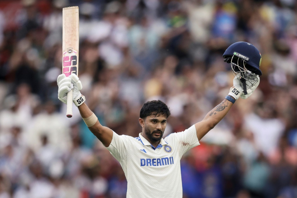 India's Nitish Kumar Reddy celebrates after reaching his maiden Test 100 on day three against Australia in Melbourne,  AFP