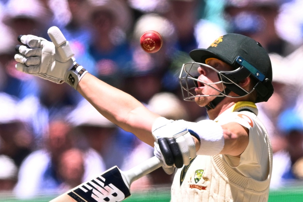 Australia captain Steve Smith reacts as he plays a shot on the second day of the fourth Ashes Test on a tricky pitch at the MCG