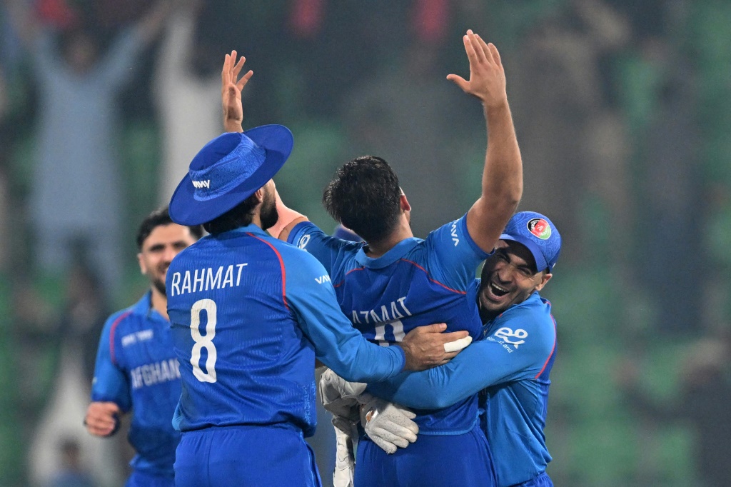 Afghanistan celebrate victory over England in Lahore, AFP