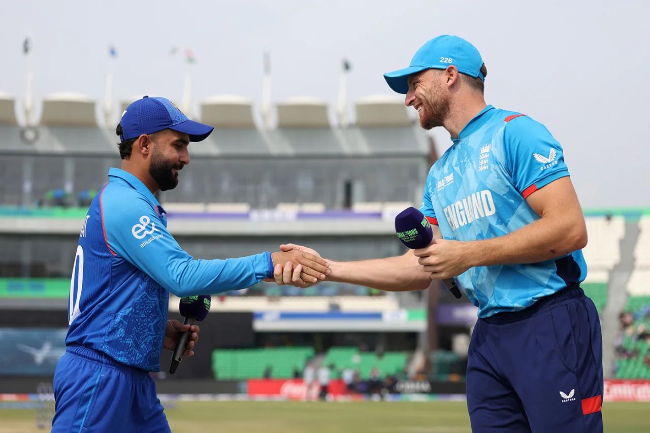 Hashmatullah Shahidi and Jos Buttler shake hands ahead of the toss