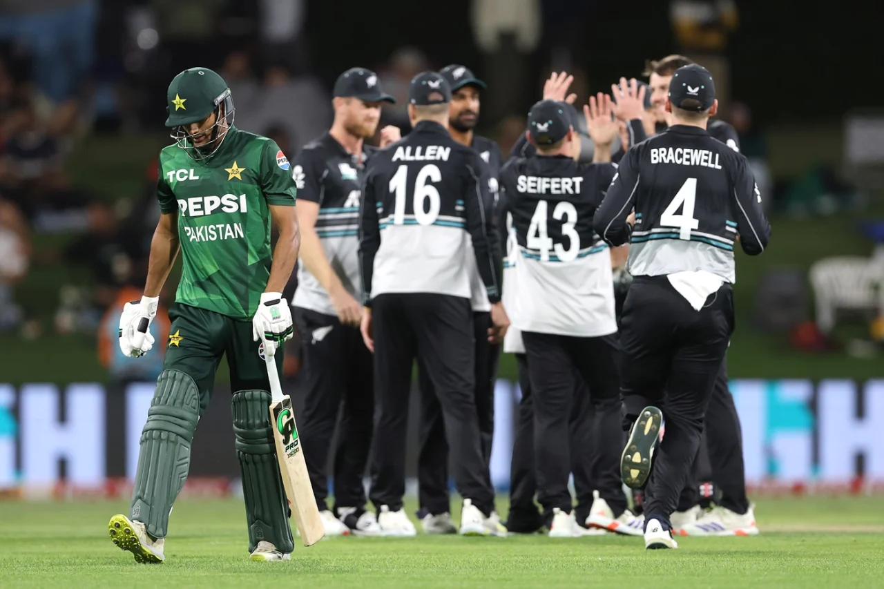 Hasan Nawaz walks away as New Zealand celebrate the early wicket