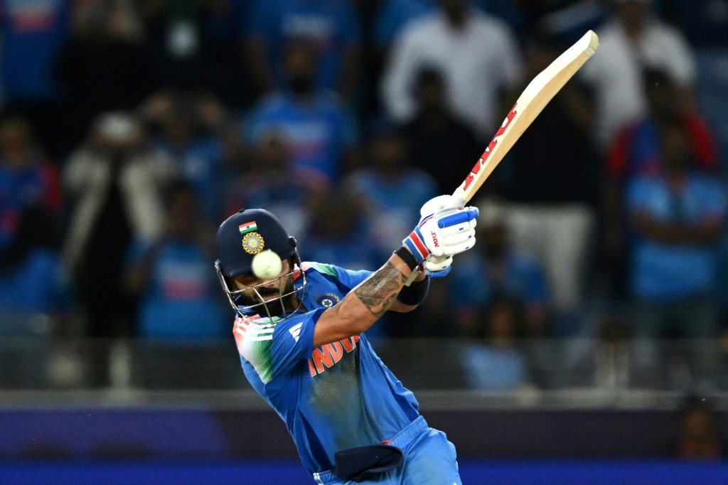 India's Virat Kohli hits the winning boundary against Pakistan in Dubai, AFP