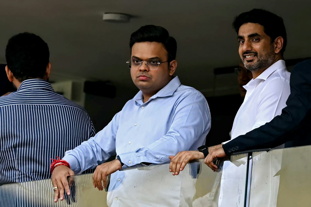International Cricket Council (ICC) chairman Jay Shah (C) and Indian politician Nara Lokesh (R)