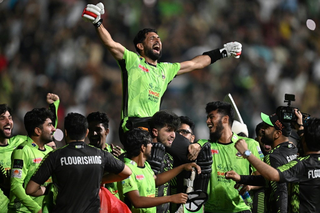 Lahore Qalanders carry Sikandar Raza off triumphantly as they celebrate their victory in the Pakistan Super League (PSL) final