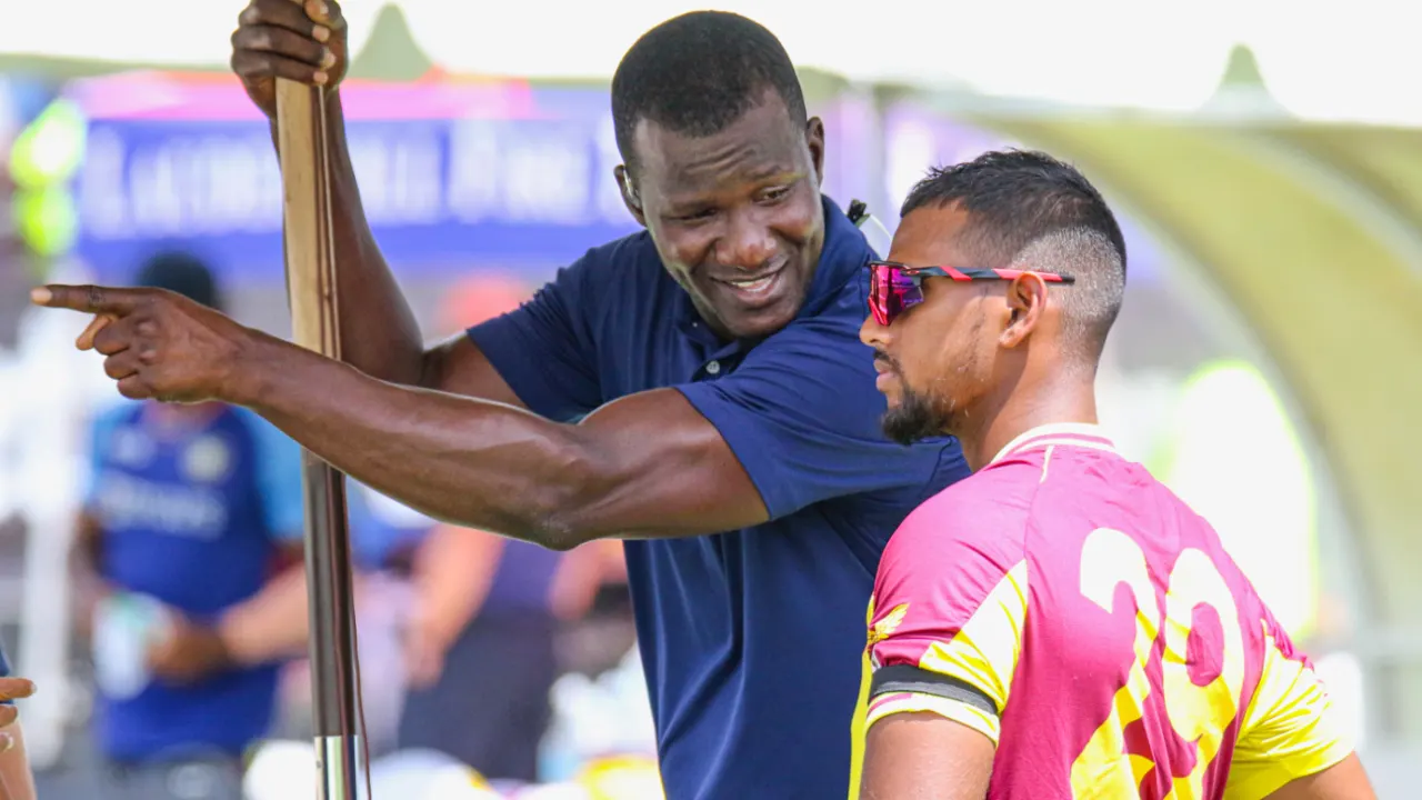 Daren Sammy with Nicholas Pooran