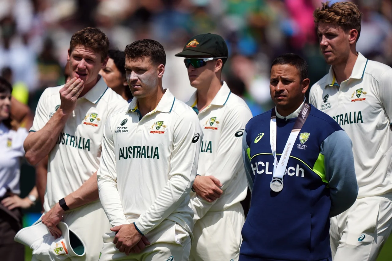 A dejected Australian team looks on