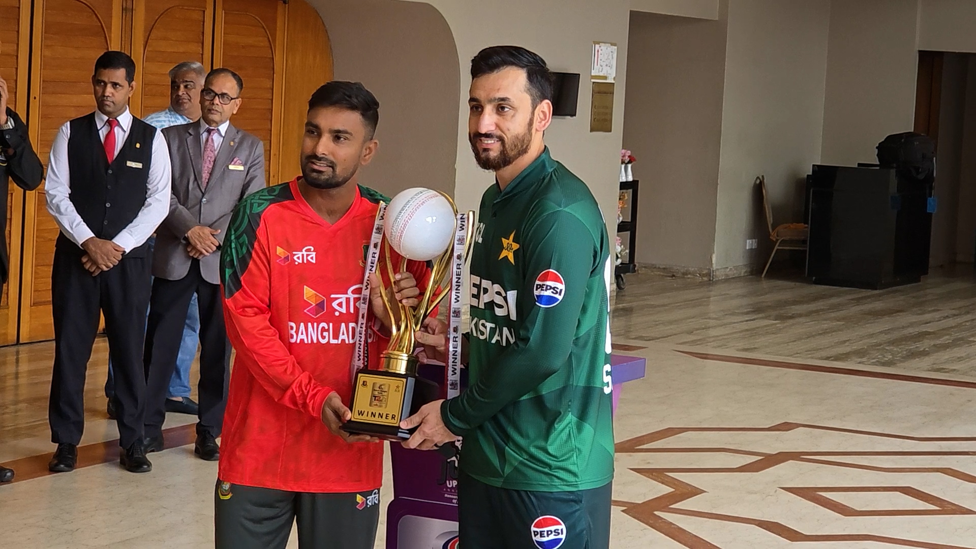Two captains with the trophy, Cricfrenzy