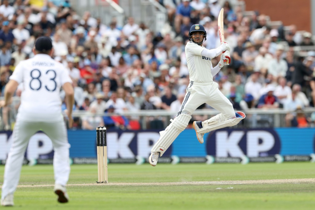 India captain Shubman Gill (R) square-cuts a four in the fourth Test against England at Old Trafford