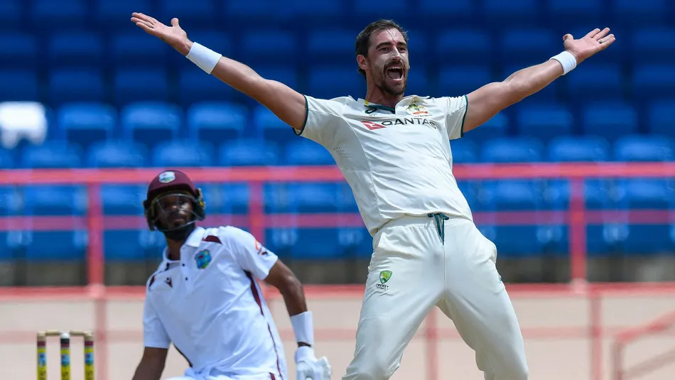 Australia’s Mitchell Starc celebrates taking the wicket of West Indies captain Roston Chase