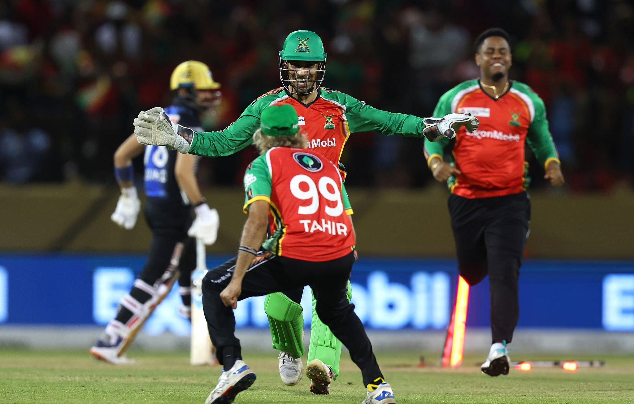 Guyana's captain Imran Tahir celebrates a wicket with his teammates