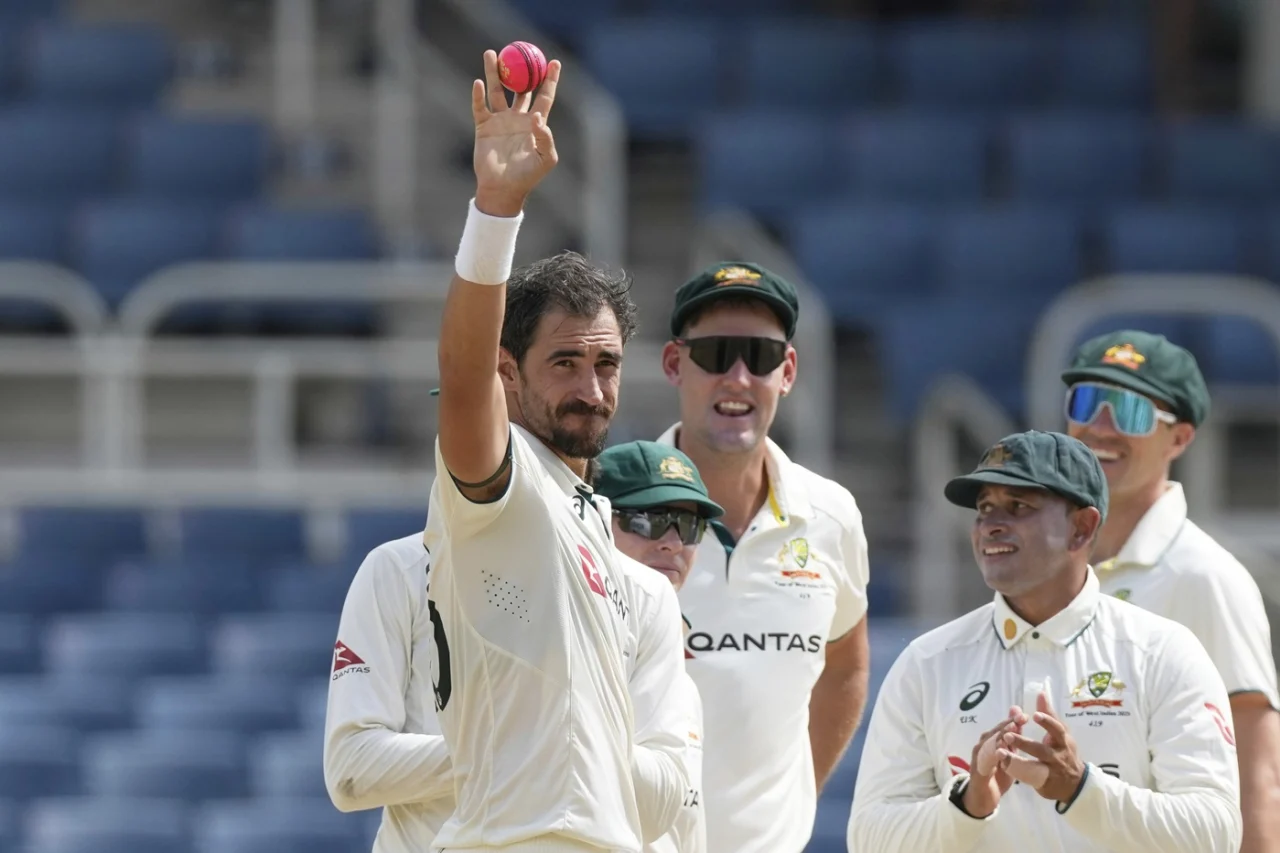 Mitchell Starc celebrates his 400th Test wicket